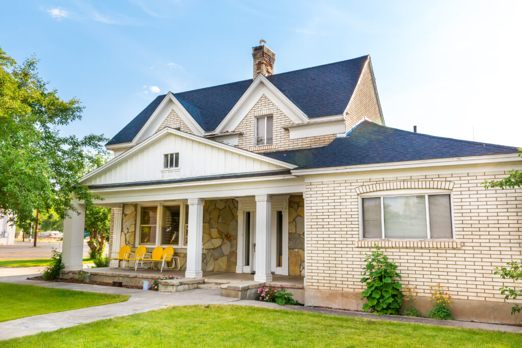 a house with a lawn and a porch